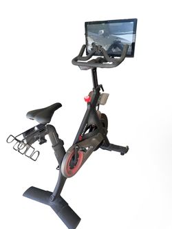 Peloton Indoor Exercise Bike with Screen and shoes