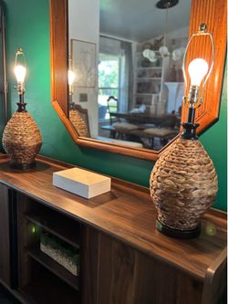 Two sea grass rattan wicker table lamps 27 1/2 inches tall 8 1/2 inches wide