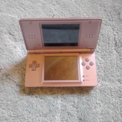 Metallic Rose Pink Nintendo DS Lite console in clean physical shape.