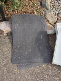 Two rubber padded floor mats