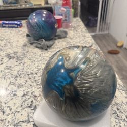 two bowling balls and bag