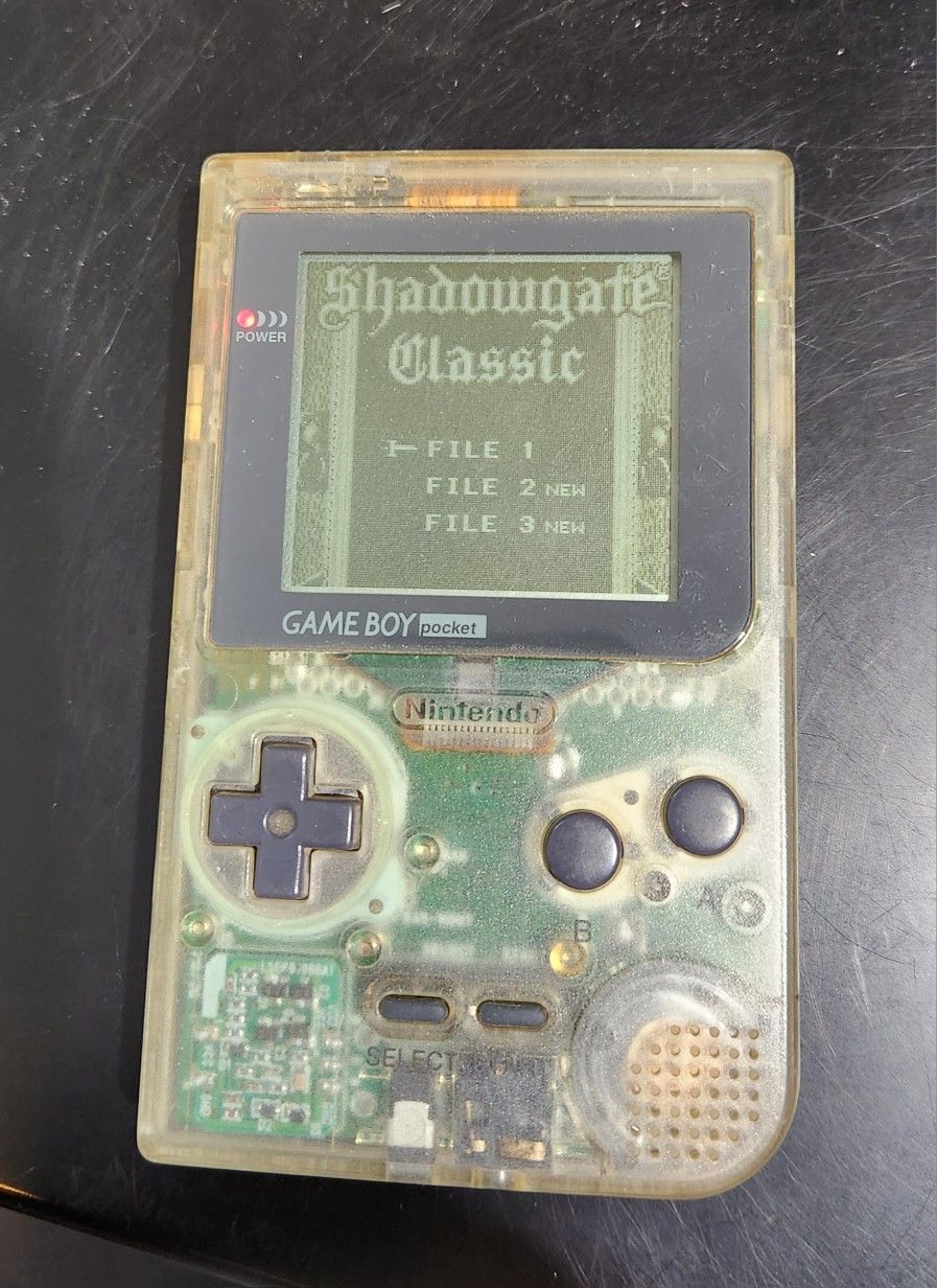 Vintage Pocket Gameboy With Game