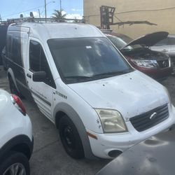 2012 Ford transit Connect cargo XLT 120k miles clean title has protection gate and shelves run good