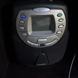 This is an Audiovox CD player AM/FM clock radio, likely model CD1180. 