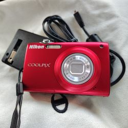 Nikon Coolpix S205 digital camera in red. 