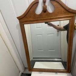 Authentic Ethan Allen Heirloom Collection wall mirror in the classic Nutmeg Maple finish.