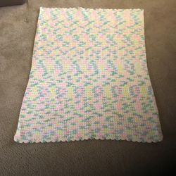 Crocheted baby blanket 45” x 34”. Never used