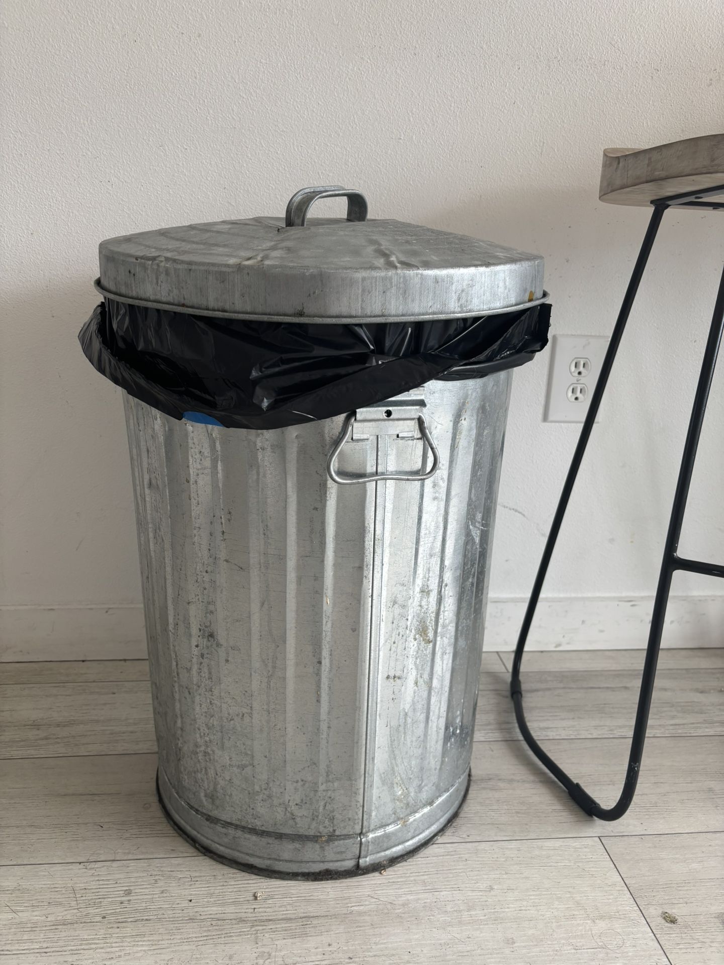 Two silver trash Cans 
