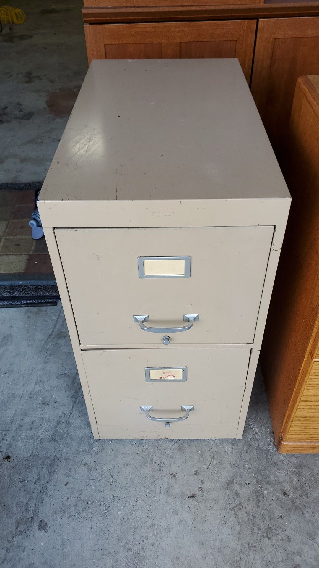 Beige metal two drawer filing cabinet