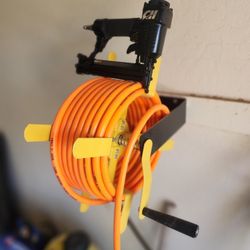 Air Compressor 50 ft. Hose, Wall Mount Reel, Staple Gun & Tire Gauge 