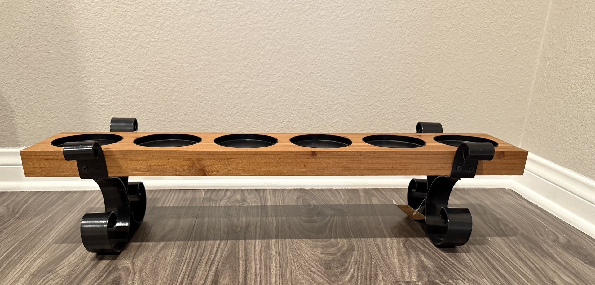 Wood candle holder with metal scroll
