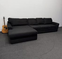 Oversized Prestiged Black Sectional Couch. In good condition. We deliver & setup.