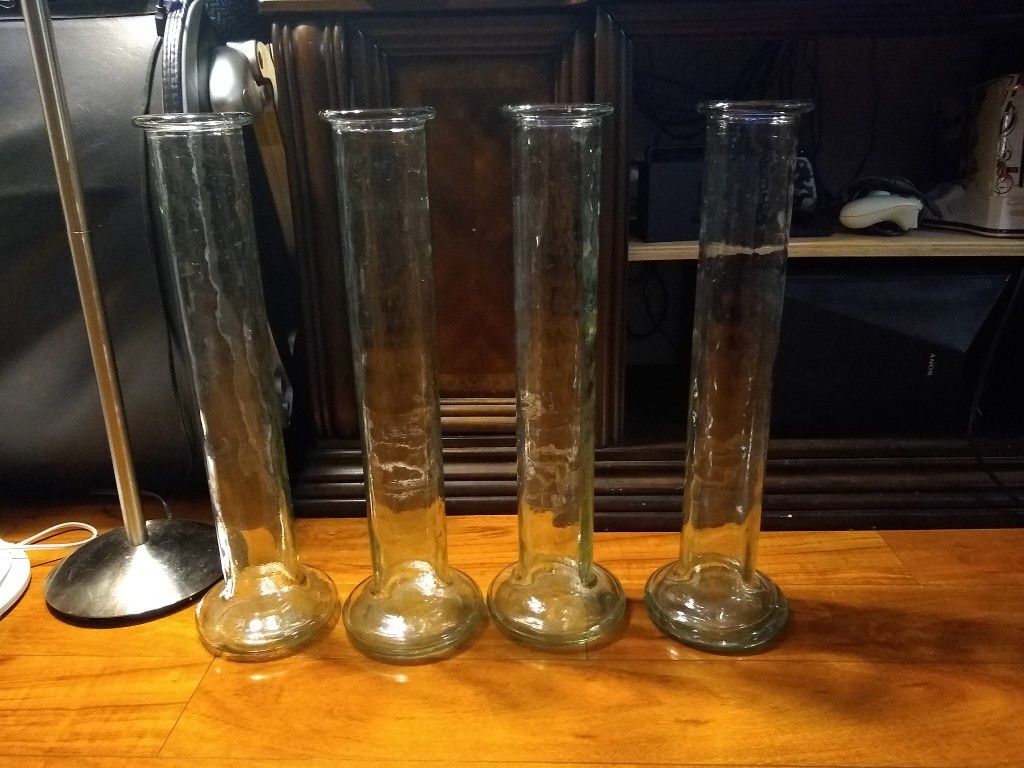 Set of 4 matching oversize glass floor vases