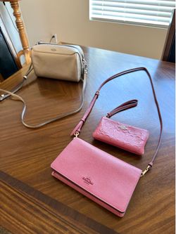Two Coach Purses and One Coach Wallet