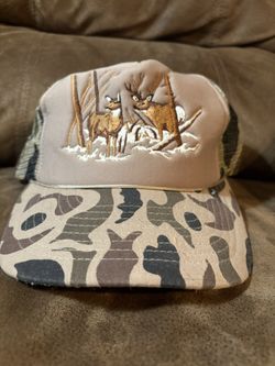 Navy blue school bus driver hat. It has a plastic adjustable back strap. There is a white mesh band that helps with cooling. It looks like might have 