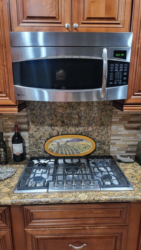 GE PROFILE MICROWAVE OVEN (OVER THE COUNTER) PLUS BOSCH 31" WIDE STOVE