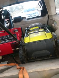 New Ryobi electric lawnmower ! Used once! Comes with battery and charger