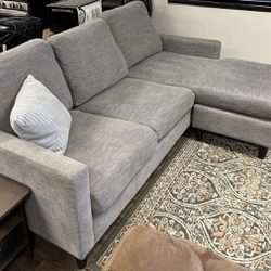 Living Spaces Light Gray 80" Sectional Sofa with Reversible Chaise