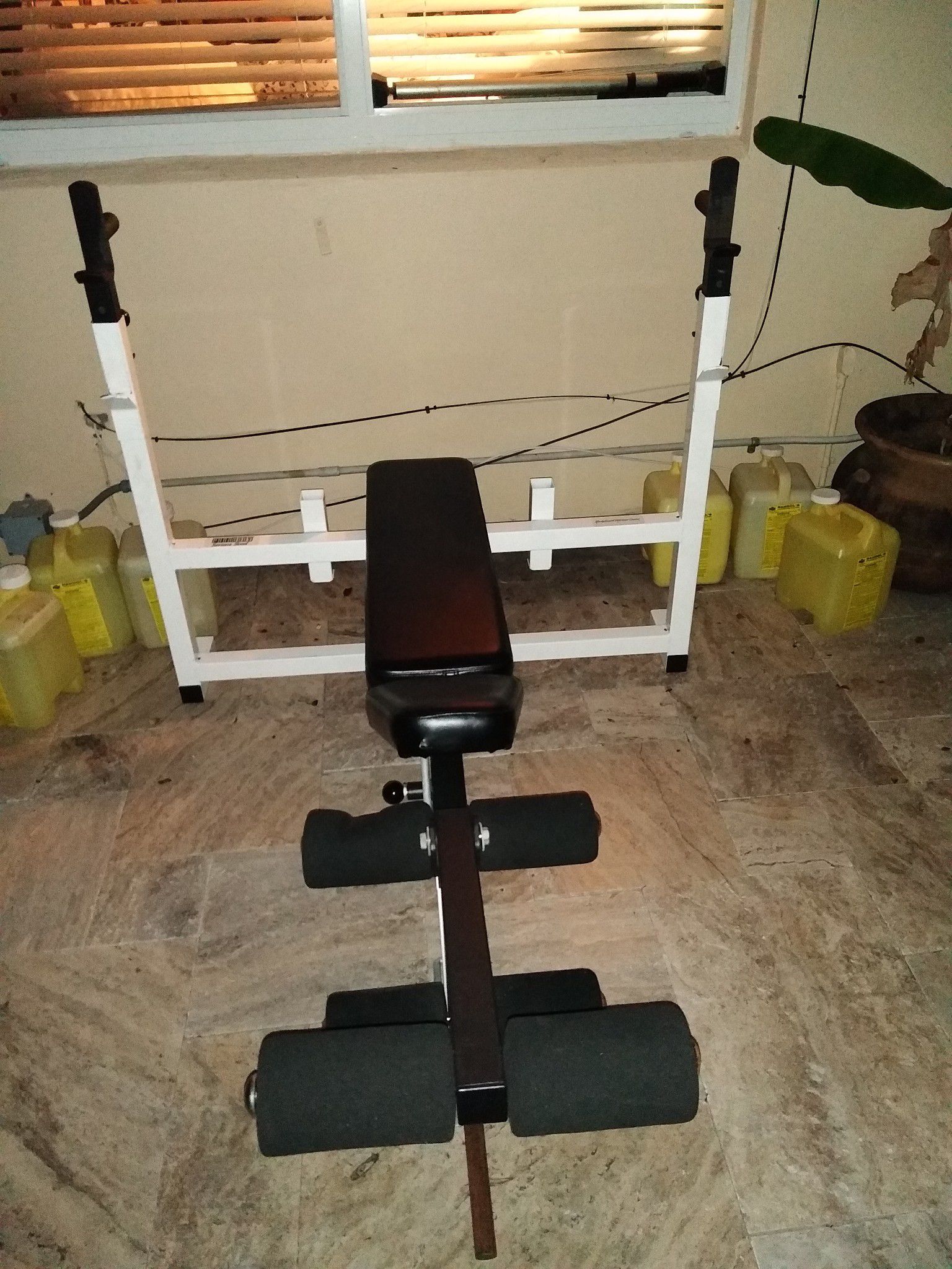 Professional weight bench with attachment for legs and hamstrings. Bench is high quality built and in brand new condition