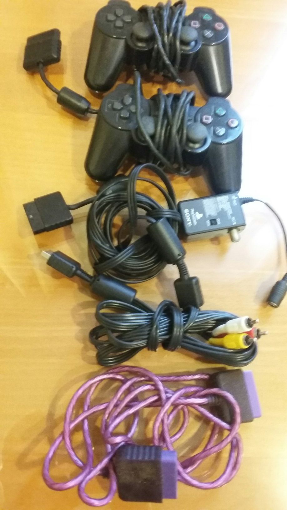 2 CONTROLERS SONY PLAYSTATION WITH EXTRA CABLES $14 FOR ALL