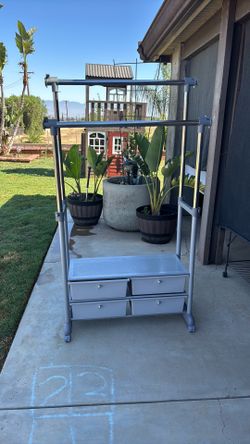 Clothes rack with four small drawers