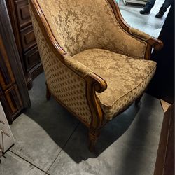Gold upholstered chairs, a set of two