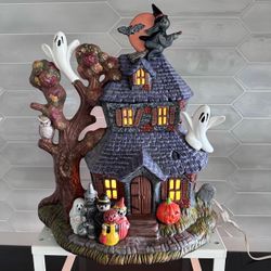 Vintage Halloween haunted house ceramic light up. This is large 14” wide x 15 1/2” tall and very well done. Great colors and spooky creatures.