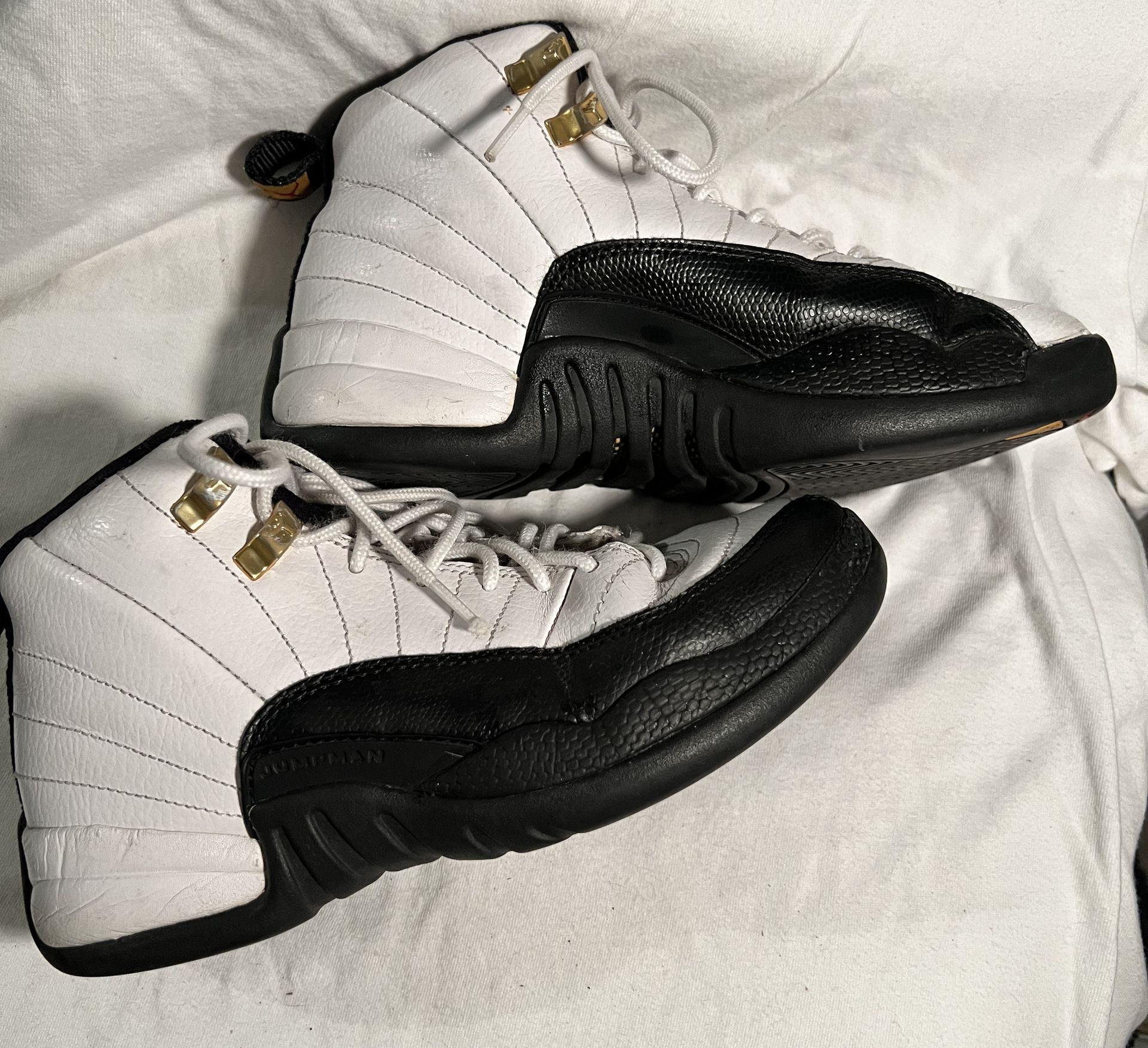 These are Air Jordan 12 Retro sneakers in the "Taxi"