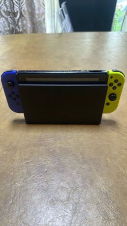 Nintendo Switch with Blue and Yellow Joy-Cons