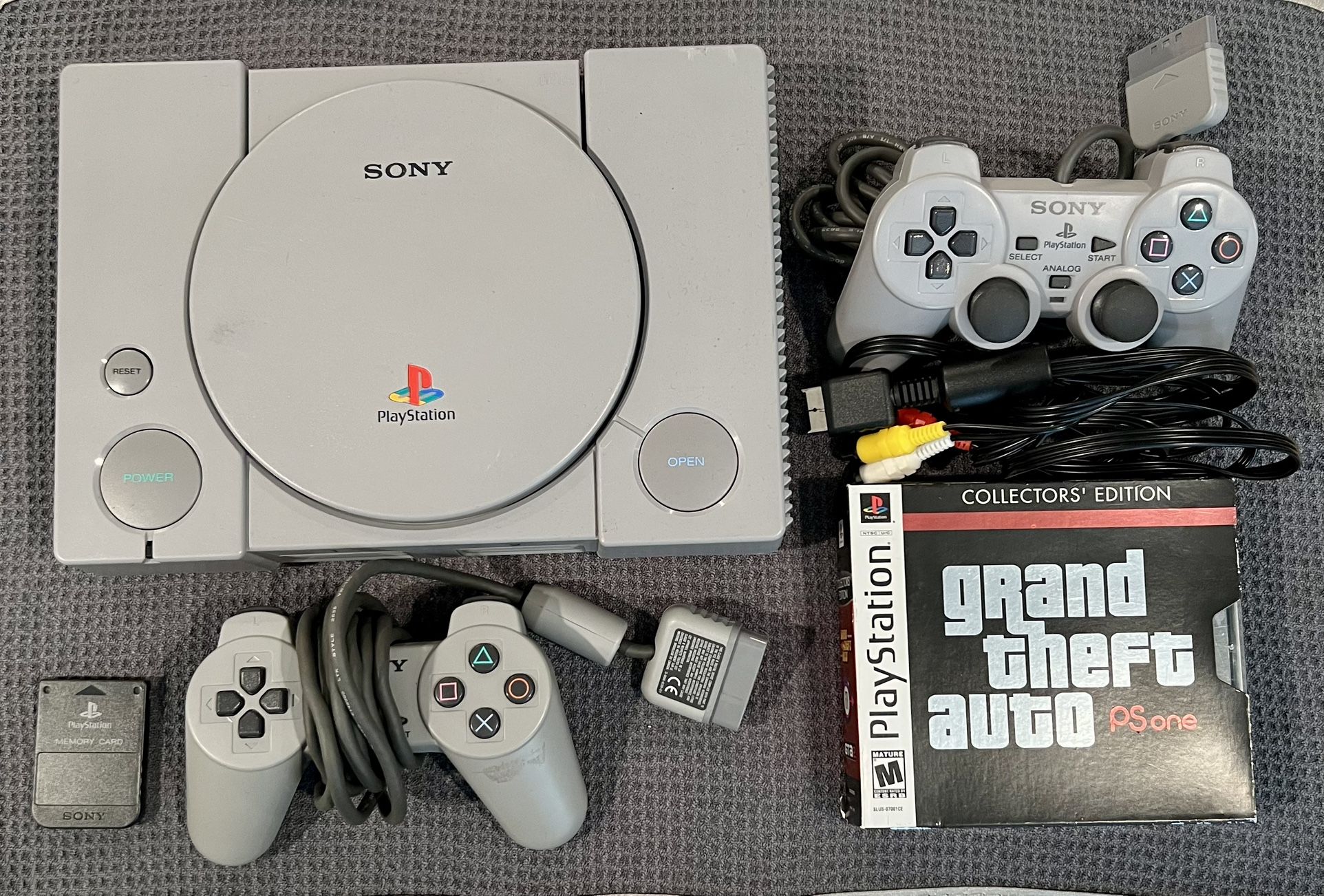 Sony PlayStation One Console W/Power Cables, 2 Controllers, GTA Collectors’ Edition & PS Memory Card