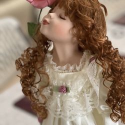 Porcelain doll (head, arms and legs made of porcelain).