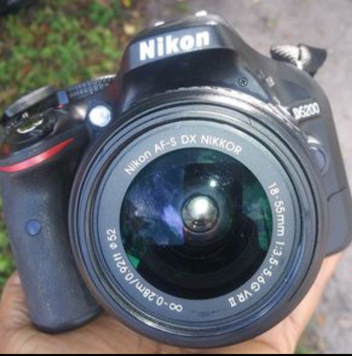 Nikkon digital camera and lens with battery