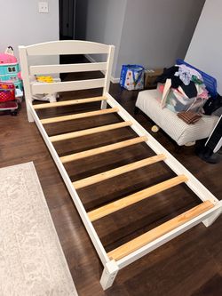 White wooden twin bed frame