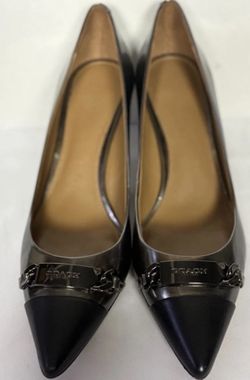 Authentic Coach Lauri pointed-toe pumps in women’s size 7.5 with a comfortable 2-1/4" to 2-1/2" heel height. Features semi-matte calf leather or suede