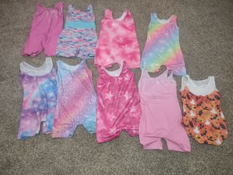 A lot of nine girls gymnastics leotards sizes 6/7 and 7/8