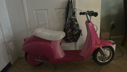 Hot pink razor moped