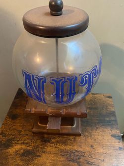 Nuts” vintage glass globe dispenser