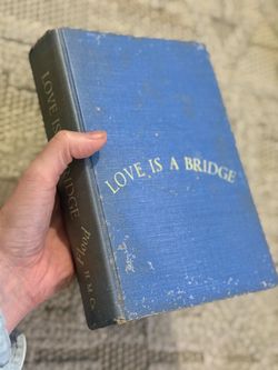 vintage hardcover edition of the novel Love Is a Bridge by Charles Bracelen Flood 1953   Classic deep blue cloth-covered decorative book for home acce