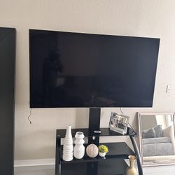 75” Sony TV and Black Glass TV Stand
