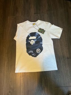 white and navy blue bape shirt size: M