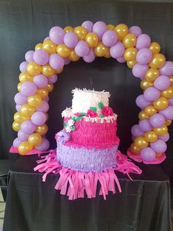 Pinata and cake arch