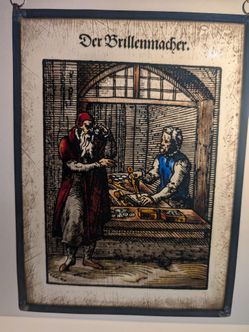 Vintage German Painted Glass Panel "Der Brillenmacher"