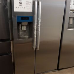 induction range and a side by side refrigerator counter deep.