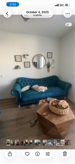 Tuffed blue couch and love seat