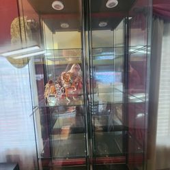 Two All glass curio with 4 shelves each $85 ea.
16.5"w x 14.5"d x 64.25"h