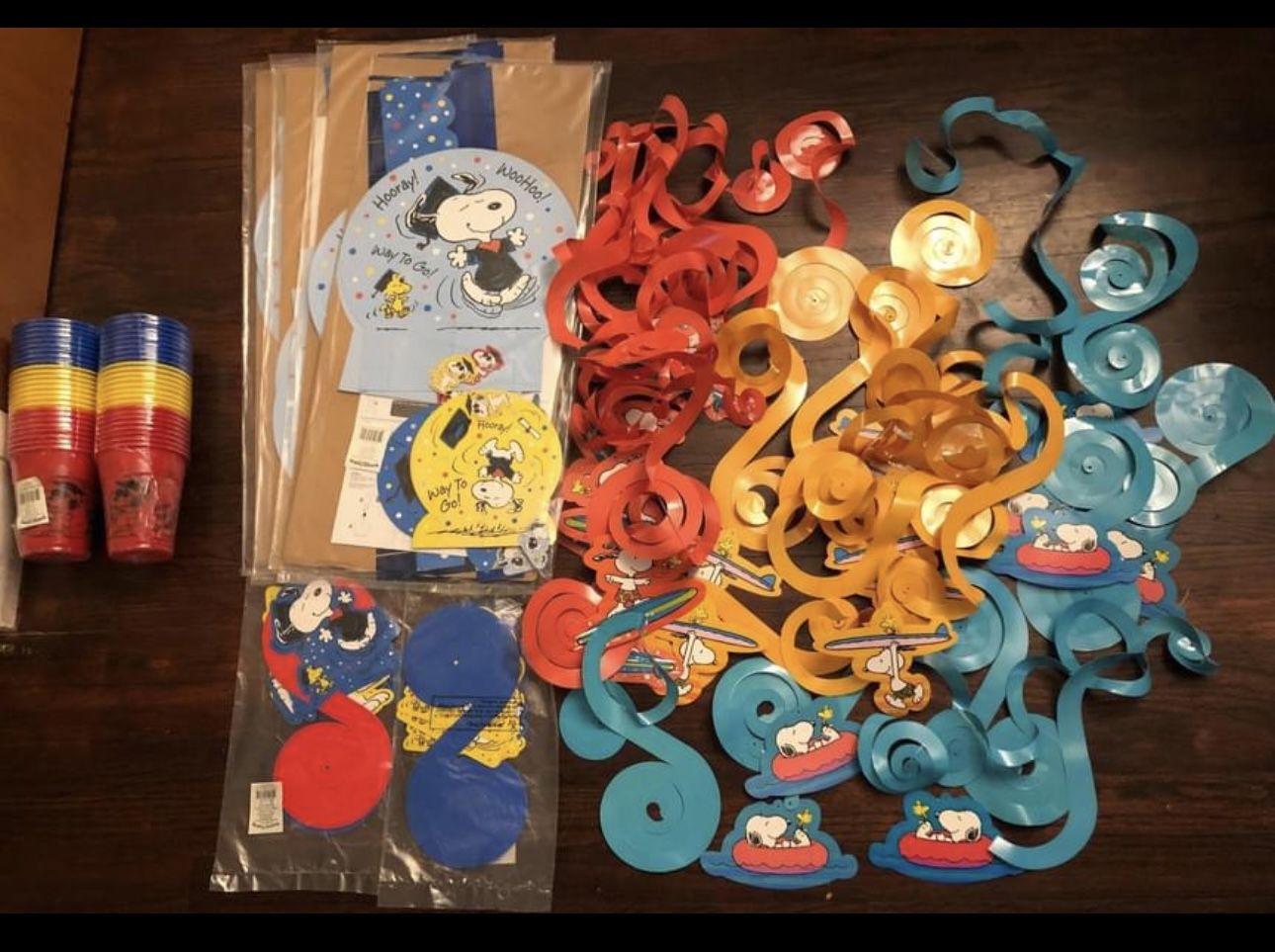 snoopy decorations and cups and other mixed lot of graduation decorations