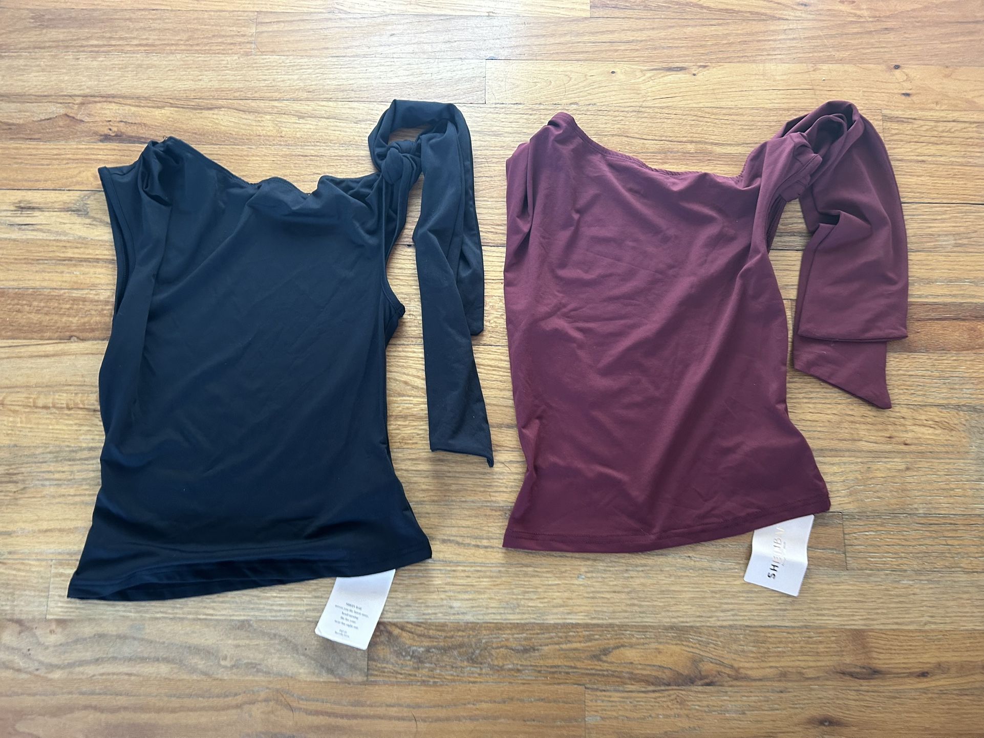 Black and burgundy tank Tops with tie embellishment on sleeve. Size extra small, both new with tags