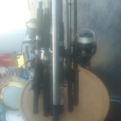 9 Fishing Poles And Reels And Captain Hook