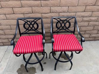 Two Black Metal Swivel Patio Barstools