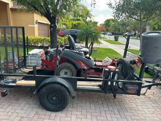 Trailer and sit down lawnmower